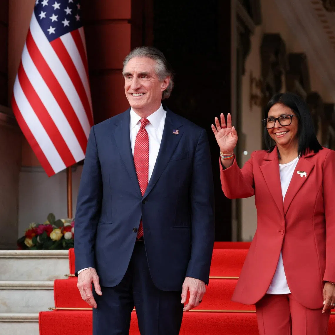 Venezuela's interim President Delcy Rodriguez gestures as she stands next to USInterior Secretary Doug Burgum in Caracas, Venezuela, on March 4.