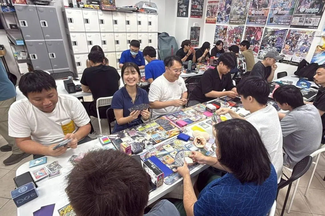 Pokemon fans play the Trading Card Game at KouritenSG, a local game store in Chinatown.