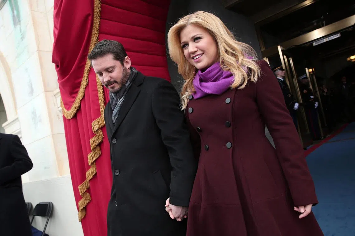 US singer Kelly Clarkson (right) and her then husband Brandon Blackstock in January 2013. The couple finalised their divorce in 2022.