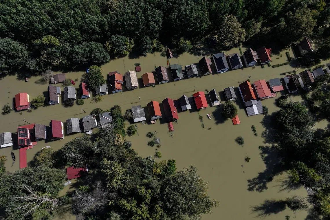 FILE PHOTO: A drone view shows houses flooded by the Danube River in the village of Ersekcsanad, Hungary, September 22, 2024. REUTERS/Marko Djurica/File Photo