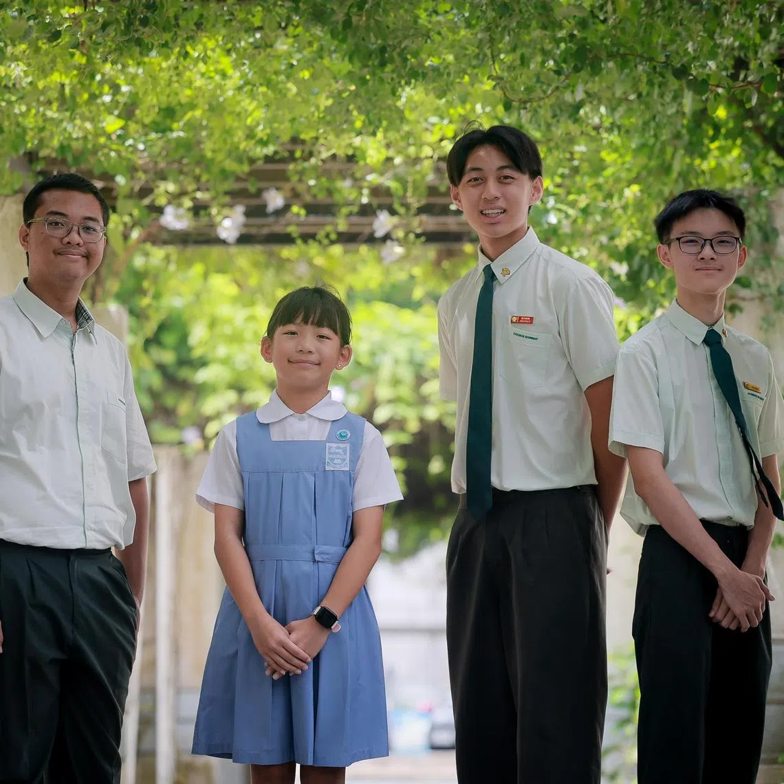 Tao Nan School pupil Chia Sze En (in blue), 10, and Evergreen Secondary School students (from left) Muhammad Aidil Putra Bin Md Indra, Jeremy Dwight Kristian and Choo Koi Heng at the Singapore Silent Heroes Student Award Ceremony held at  Spring Singapore onJuly 5, 2025.