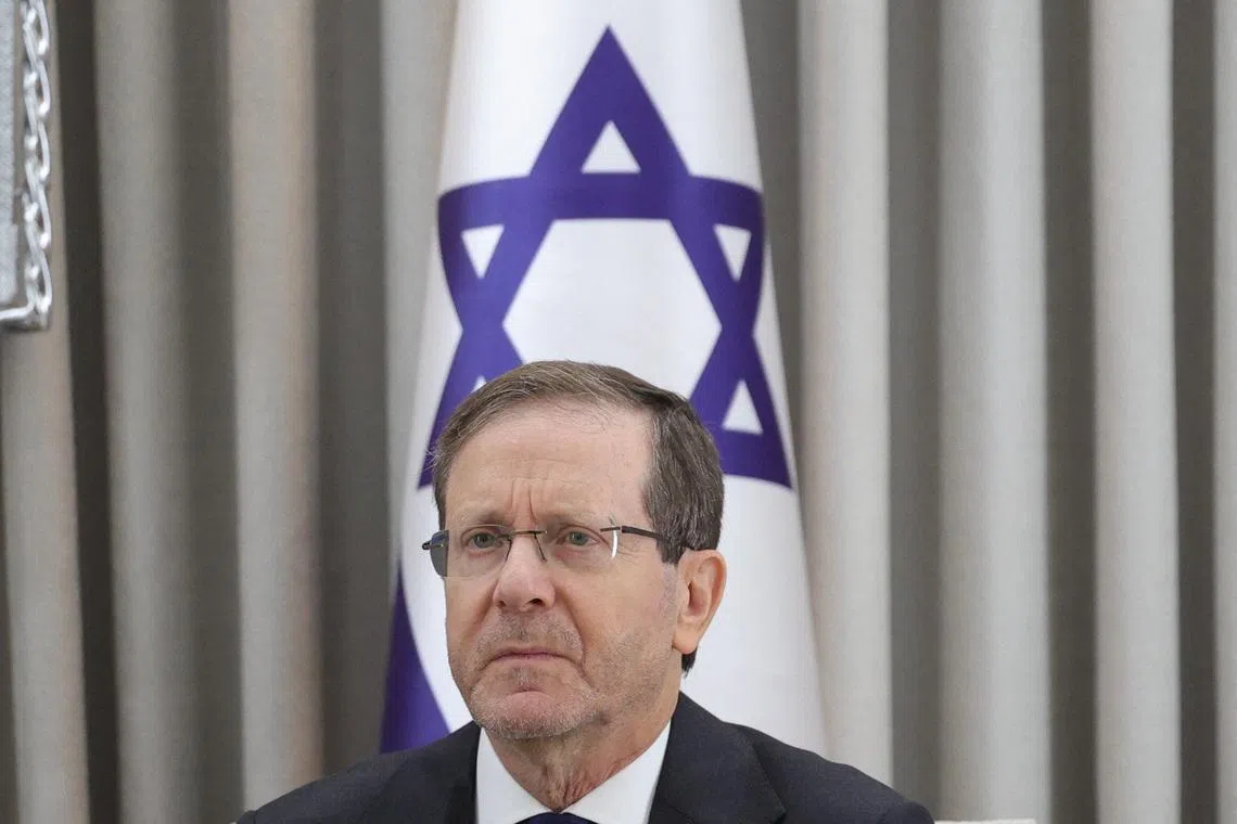 Israeli President Isaac Herzog looks on during a meeting with German Chancellor Friedrich Merz at the President's residence in Jerusalem, December 6, 2025.    Abir Sultan/Pool via REUTERS