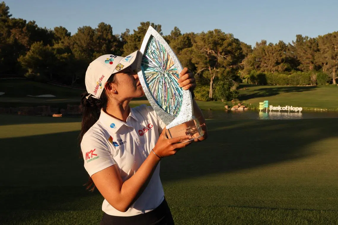 Pajaree Anannarukarn of Thailand kissing the winner's trophy at the LPGA Match-Play at Shadow Creek Golf Course in Las Vegas.