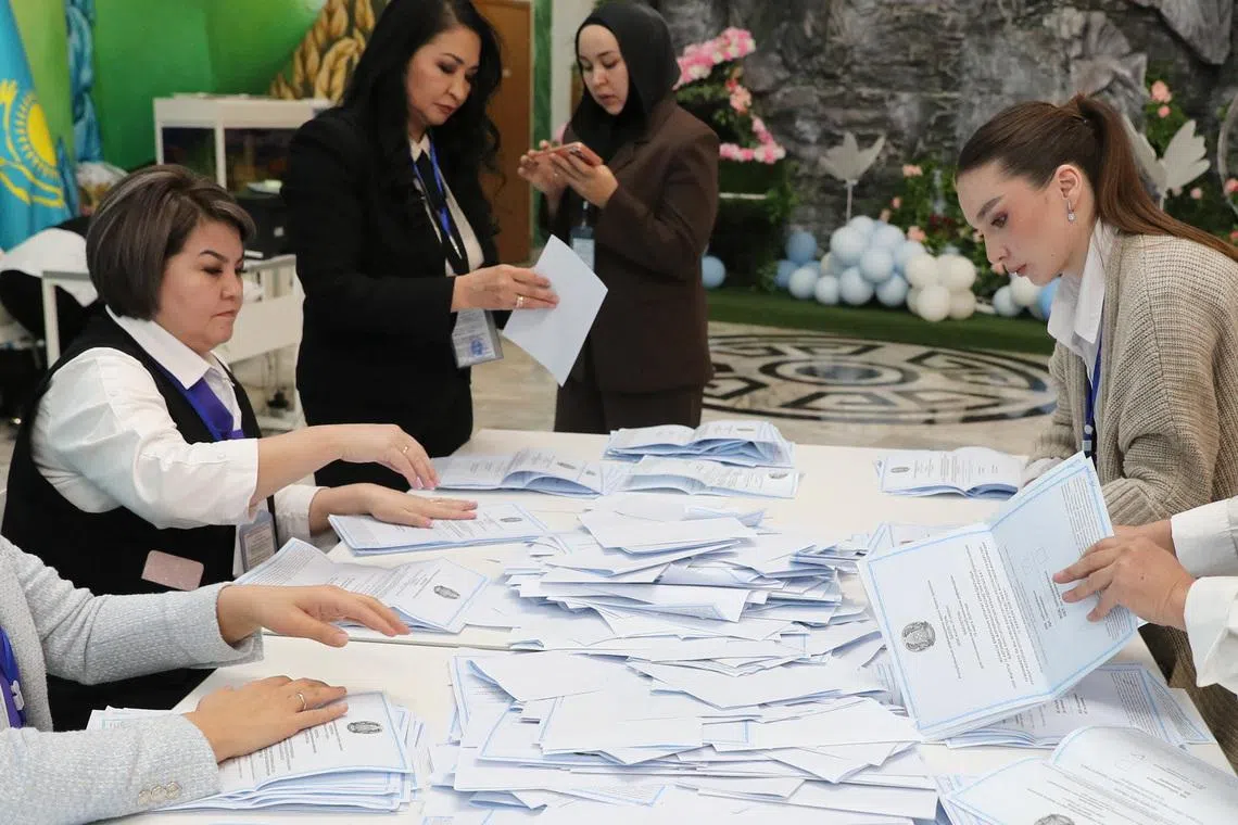Members of a Kazakh electoral commission count votes after polling stations closed on the day of a referendum on a new constitution in Almaty, Kazakhstan, March 15, 2026. REUTERS/Pavel Mikheyev