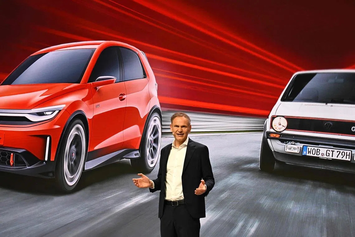 Oliver Blume, CEO of German carmaker Volkswagen (VW), addresses an annual news conference to present his company's results, in Berlin on March 13, 2024. German auto giant Volkswagen reported a forecast-beating rise in profits for 2023, boosted by higher vehicle deliveries, but gave a cautious outlook for this year. (Photo by Tobias SCHWARZ / AFP)