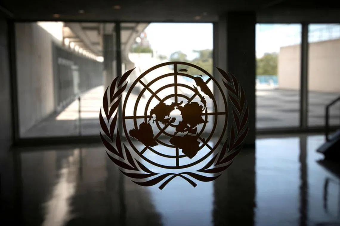 FILE PHOTO: The United Nations logo is seen on a window in an empty hallway at United Nations headquarters during the 75th annual U.N. General Assembly high-level debate in New York, U.S., September 21, 2020. REUTERS/Mike Segar/File Photo
