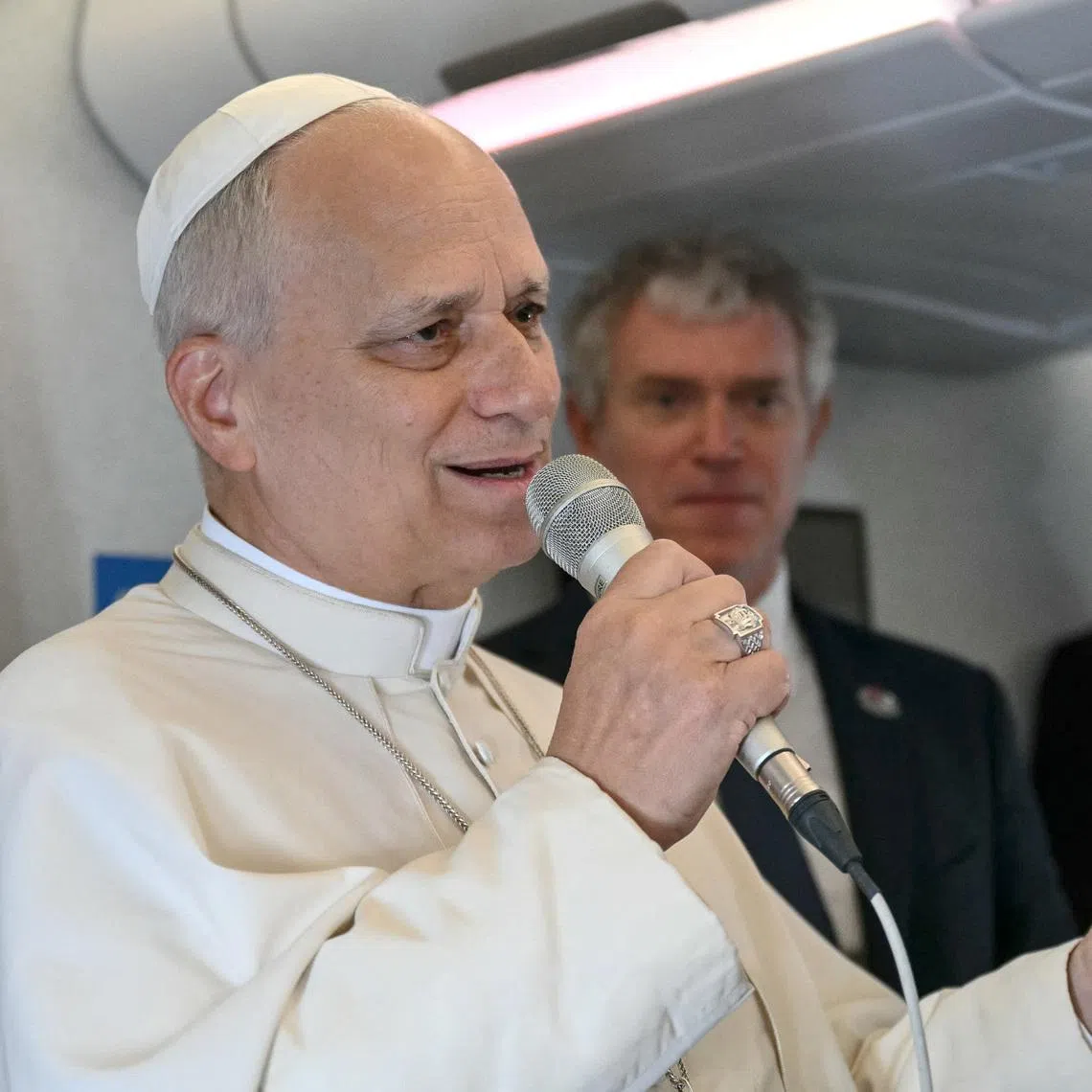 Pope Leo XIV addresses journalists during the flight heading to Malabo, Equatorial Guinea, as part of Pope apostolic journey to Africa, on April 21, 2026.
