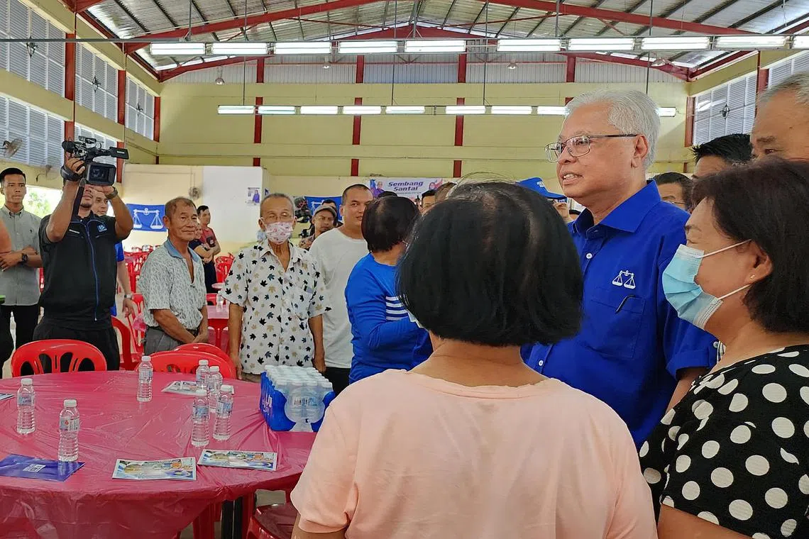Malaysia caretaker PM Ismail Sabri Yaakob meeting voters in Mengkarang, in his seat of Bera, Pahang, on Nov 16, 2022.