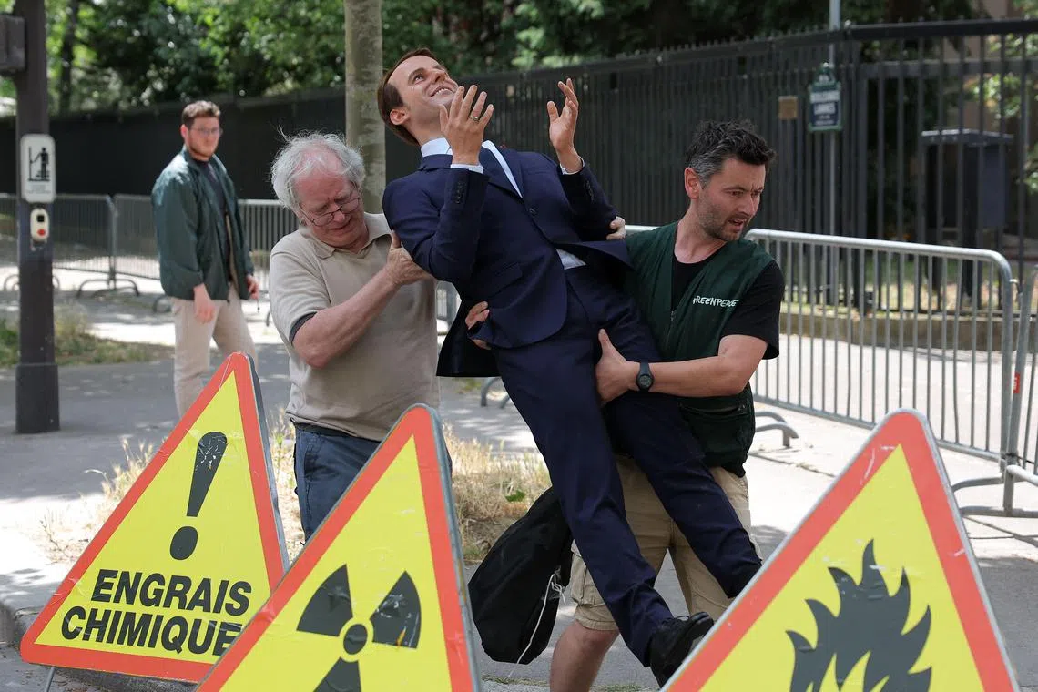 Activists set up a wax statue of French President Emmanuel Macron stolen from the Musee Grevin.