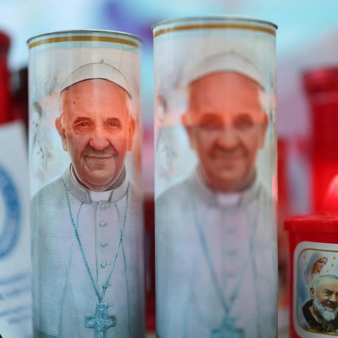 Images of Pope Francis placed outside the Gemelli Hospital in Rome, where the pontiff is admitted for treatment, on Feb 28.