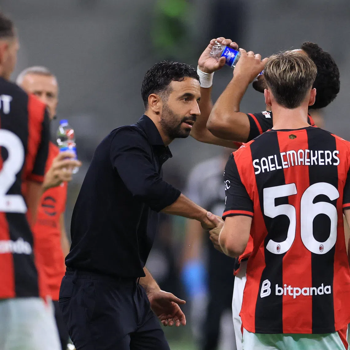 Soccer Football - Serie A - AC Milan v Lecce - San Siro, Milan, Italy - September 20, 2026 AC Milan coach Ruben Amorim with AC Milan's Alexis Saelemaekers during the match REUTERS/Claudia Greco
