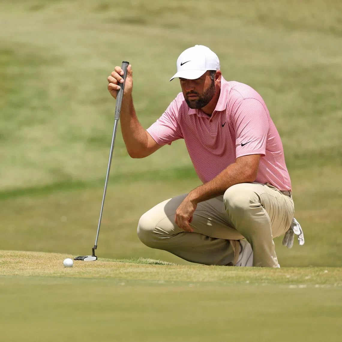 Scottie Scheffler of the United States lining up a putt on the ninth green during the second round of the FedEx St Jude Championship on Aug 14.