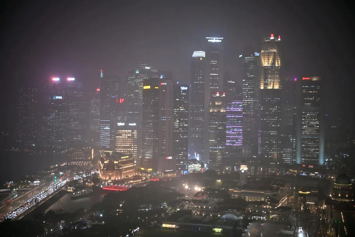 The Singapore skyline is shrouded in torrential rain on Sept 17, 2024.