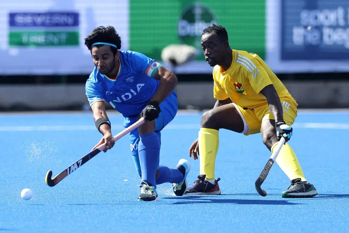 FILE PHOTO: Commonwealth Games - Men's Hockey- Pool B - India v Ghana - University of Birmingham Hockey and Squash centre, Birmingham, Britain - July 31, 2022 India's Singh Manpreet in action with Ghana's Christopher Dogbe REUTERS/Stoyan Nenov/File Photo