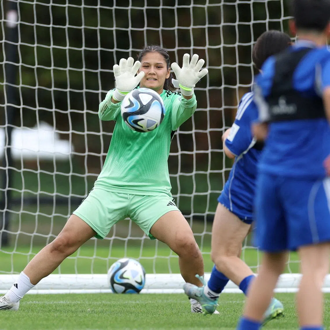 FILE PHOTO: Soccer Football - Elaha Safdari of the Afghan Women's Refugee team makes a save during a selection camp at St. George's Park, Burton upon Trent, Britain - August 26, 2025 REUTERS/John Sibley/File Photo