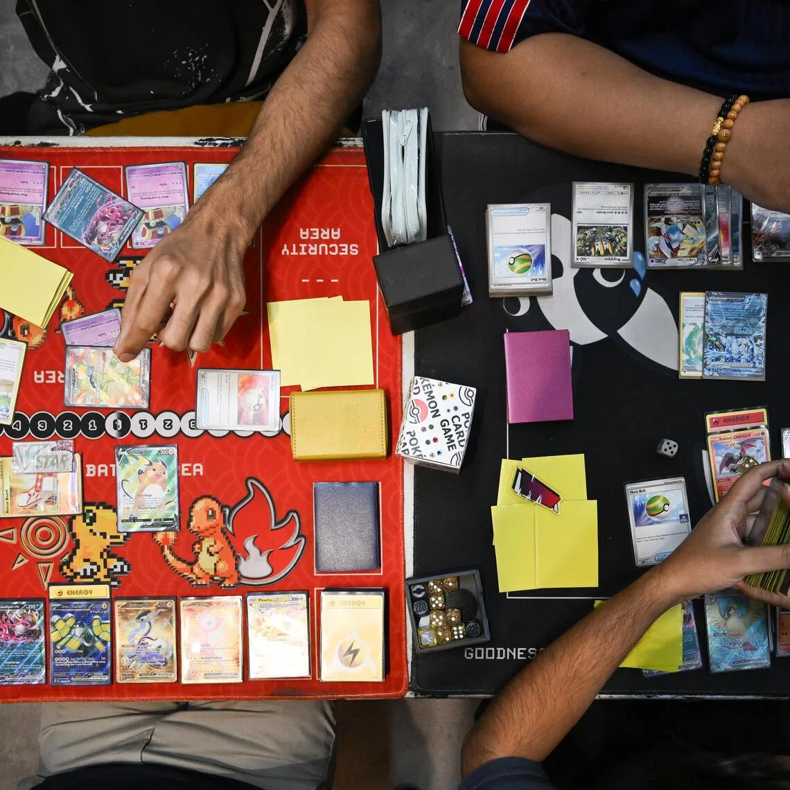 Pokémon card collectors and players playing Pokémon cards.