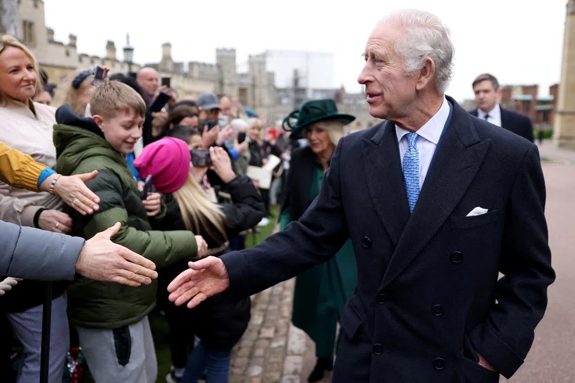 FILE PHOTO: Britain's King Charles and Queen Camilla greet people after attending the Easter Matins Service at St. George's Chapel, Windsor Castle, Britain March 31, 2024. REUTERS/Hollie Adams/Pool/File Photo