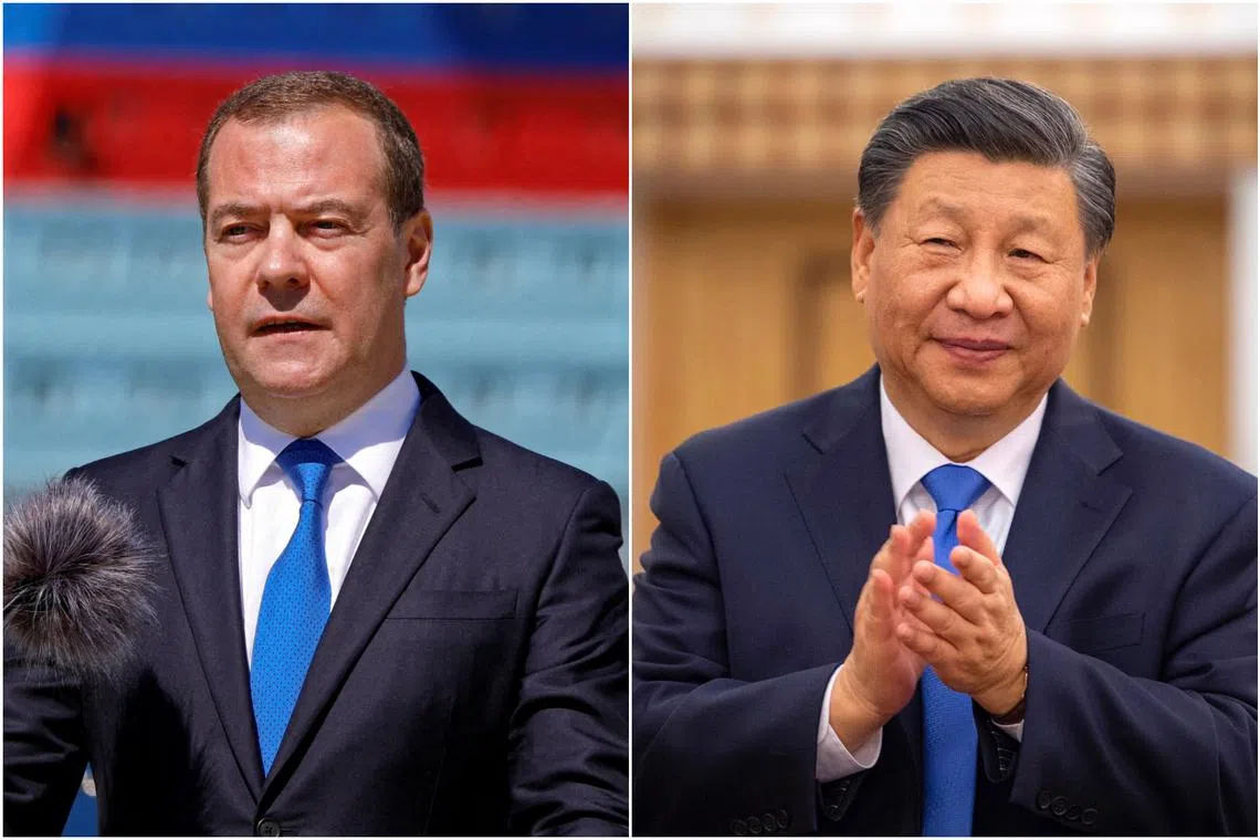 Mr Xi Jinping (right) told Mr Dmitry Medvedev he hopes the Chinese Communist Party and United Russia can promote communication.