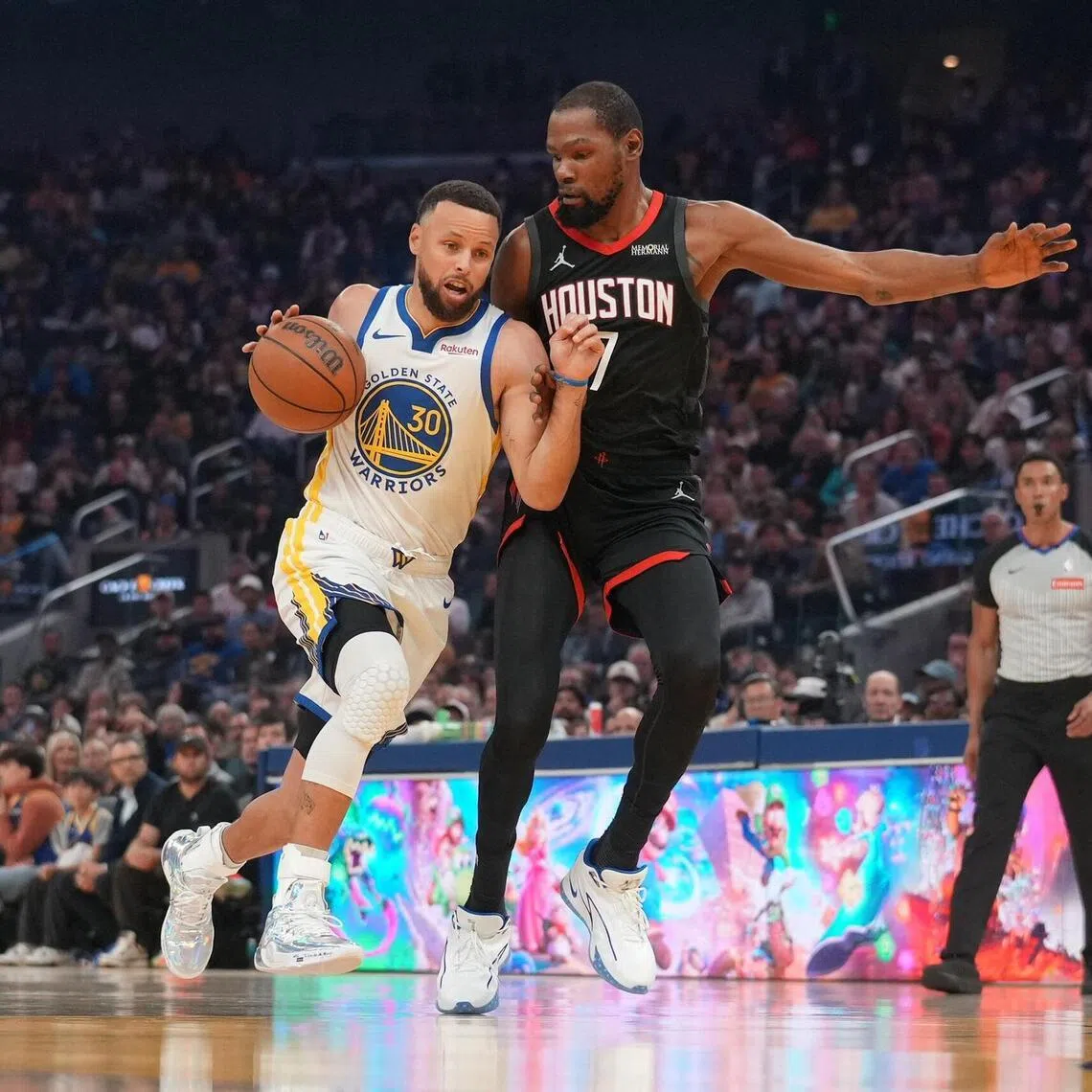 The Golden State Warriors' Stephen Curry attempting to dribble past Kevin Durant of the Houston Rockets during the Warriors' 117-116 NBA home loss on April 5.