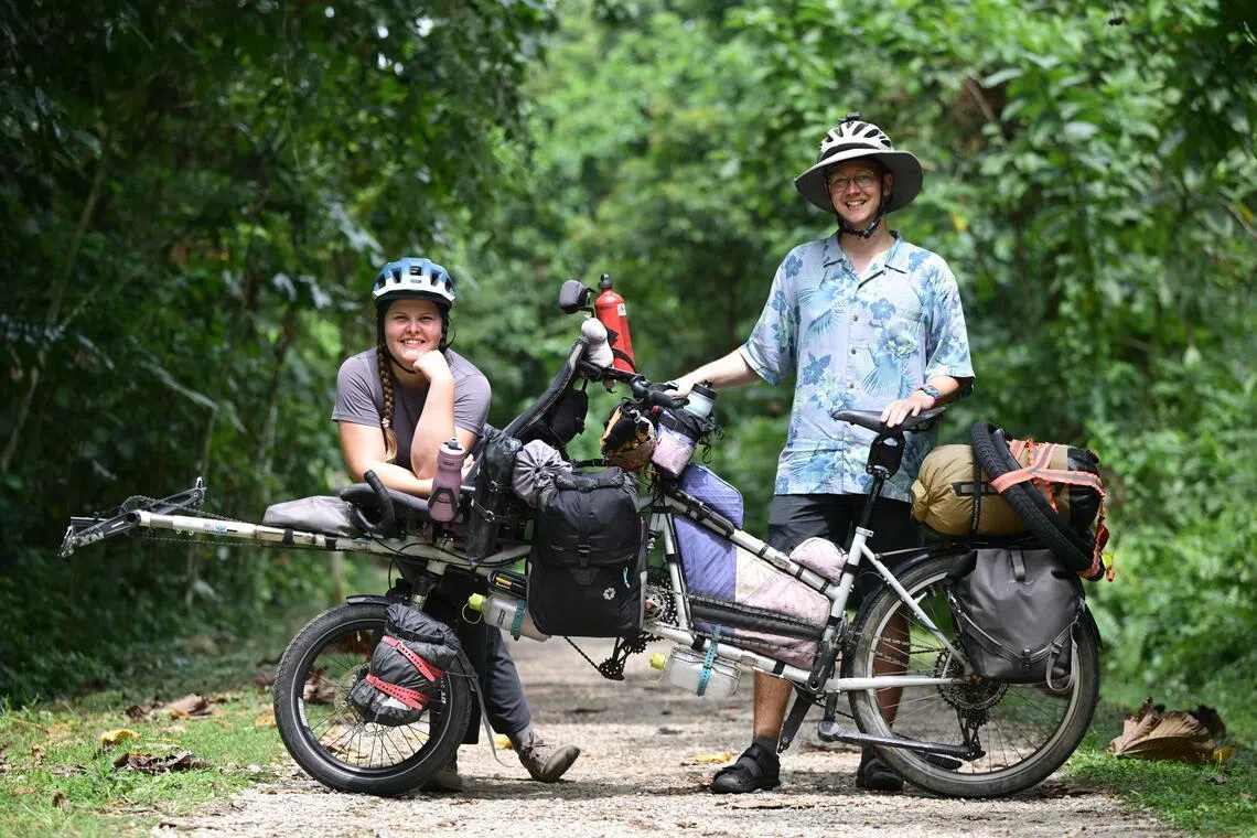 Finnish couple Roosa Turpeinen and Otto Peltola, both 29, who cycled from Finland to Singapore on a tandem bike.