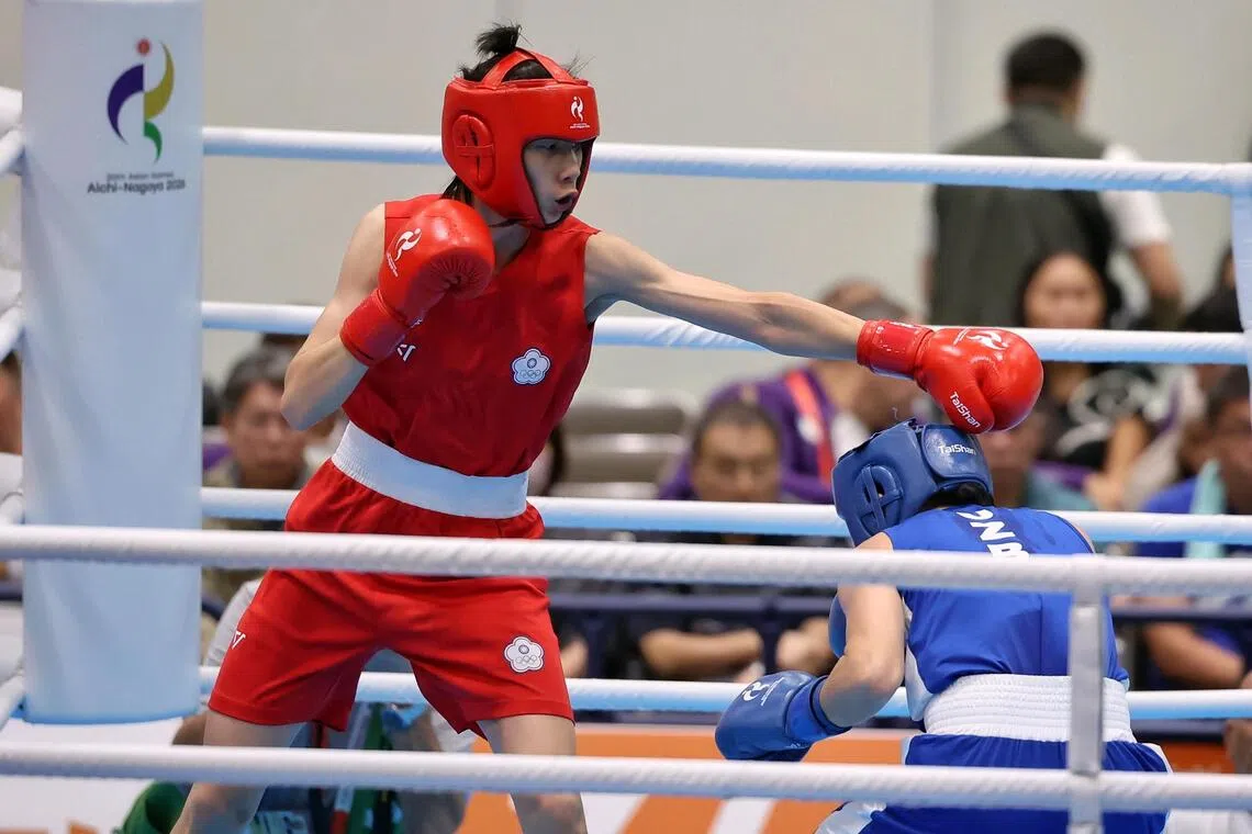 Lin Yu-ting (in red) of Chinese Taipei in action against Sitora Turdibekova of Uzbekistan during the Aichi-Nagoya 2026 Asian Games.