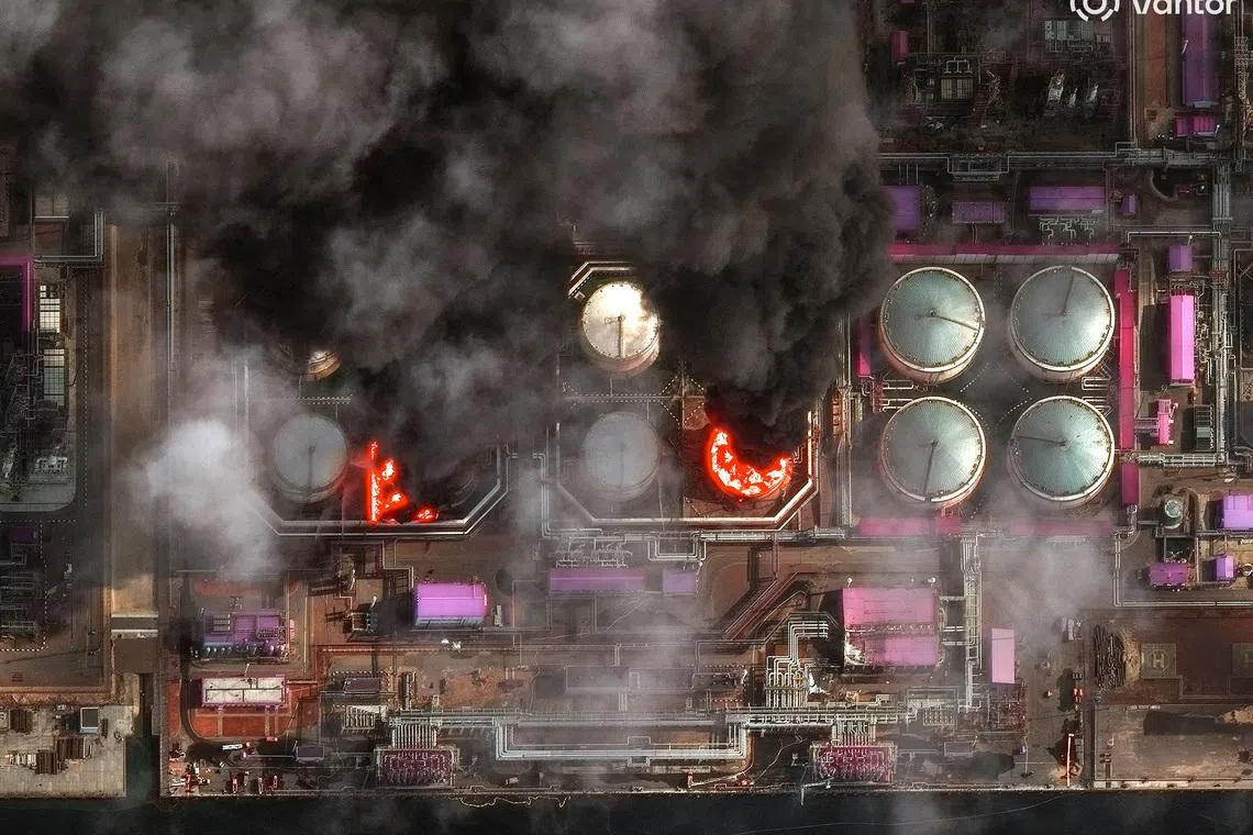 A satellite near-infrared image shows smoke rising from oil storage tanks at Russia's Baltic Sea port of Ust-Luga, which was struck multiple times in Ukrainian attacks, in Ust-Luga, Russia March 29, 2026. Vantor/Handout via REUTERS