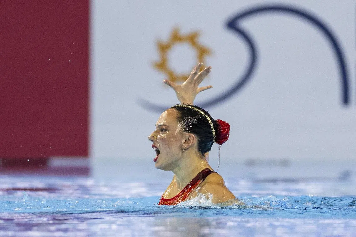 ST20250718_202504000527/kkartistic18/Brian Teo/Kimberly Kwek MR/Australian artistic swimmer Zoe Poulis competing in the Women's Solo Technical event at the World Aquatics Championships at the World Aquatics Championships Arena on July 18, 2025. ST PHOTO: BRIAN TEO 