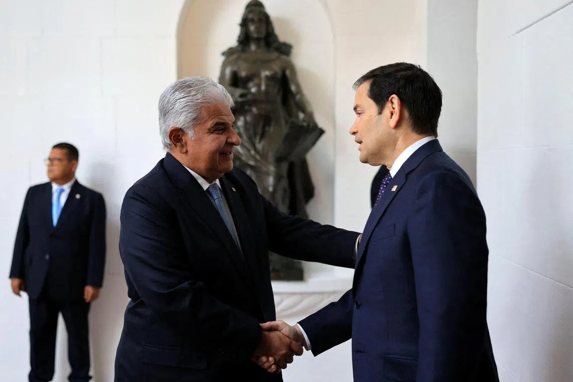 TOPSHOT - Handout picture released by Panama's Presidency press office showing Panama's President Jose Raul Mulino (L) greeting US Secretary of State Marco Rubio on arrival at the presidential palace in Panama City on February 2, 2025. Rubio arrived on the eve on his debut trip abroad as US secretary of state, as he looks for how to follow up on President Donald Trump's extraordinary threat to seize the Panama Canal. (Photo by Handout / PANAMA'S PRESIDENCY PRESS OFFICE / AFP) / RESTRICTED TO EDITORIAL USE - MANDATORY CREDIT 'AFP PHOTO / PANAMA'S PRESIDENCY PRESS OFFICE' - NO MARKETING - NO ADVERTISING CAMPAIGNS - DISTRIBUTED AS A SERVICE TO CLIENTS
