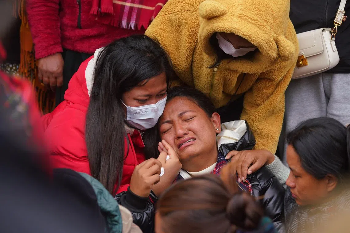 Family members of the Yeti Airlines ATR72 aircraft victims react outside the hospital mortuary in Pokhara, Nepal, Jan 16, 2023. A Yeti Airlines ATR72 aircraft carrying 72 people on board, 68 passengers and 4 crew members, crashed into a gorge while trying to land at the Pokhara International Airport.