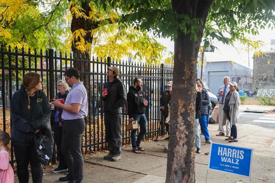 Voters waiting in line to cast their ballots in Philadelphia, Pennsylvania, on Nov 5.