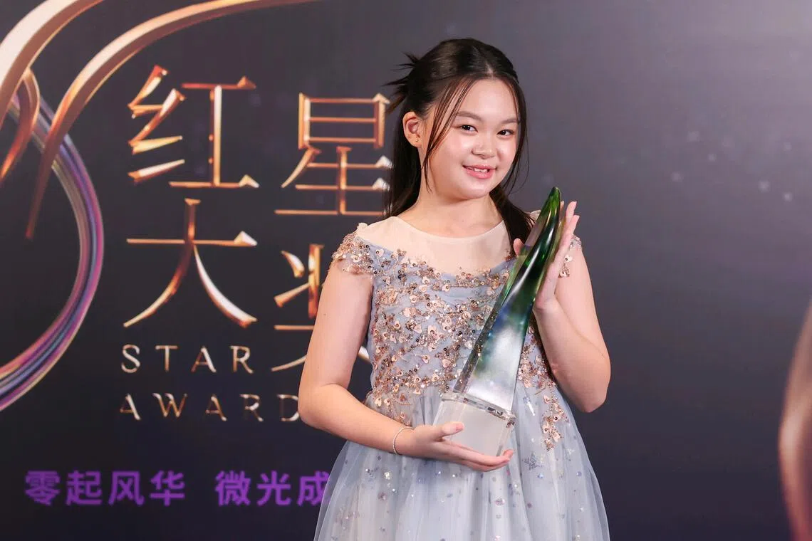 Young Talent Award winner Ivory Chia posing with the award at the Star Awards at Mediacorp on April 19.