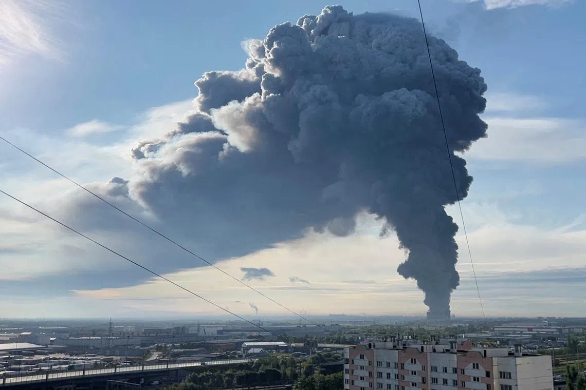 Smoke billows from the burning Wildberries warehouse following a Ukrainian drone attack, according to local authorities, in the course of the Russia-Ukraine conflict, in Saint Petersburg, Russia July 24, 2026, in this still image taken from video. REUTERS/Stringer