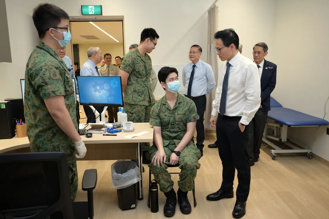 Minister of State for Defence Desmond Choo (right) on a tour of CMPB medical facilities on Oct 24.