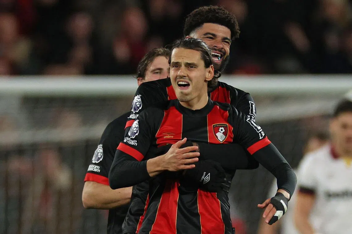Bournemouth's Enes Unal celebrates with teammates after scoring the equaliser in the 1-1 Premier League draw with West Ham United.