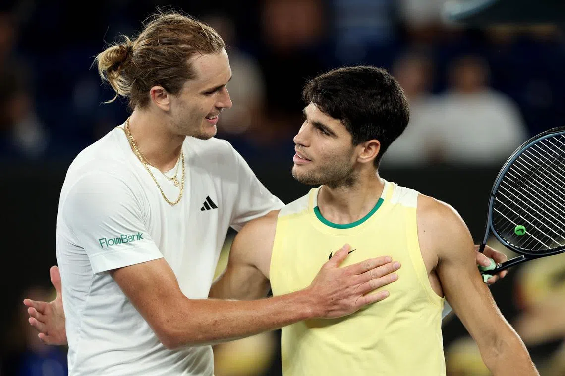 Germany's Alexander Zverev (left) consoles Spain's Carlos Alcaraz after winning their quarter-final match.