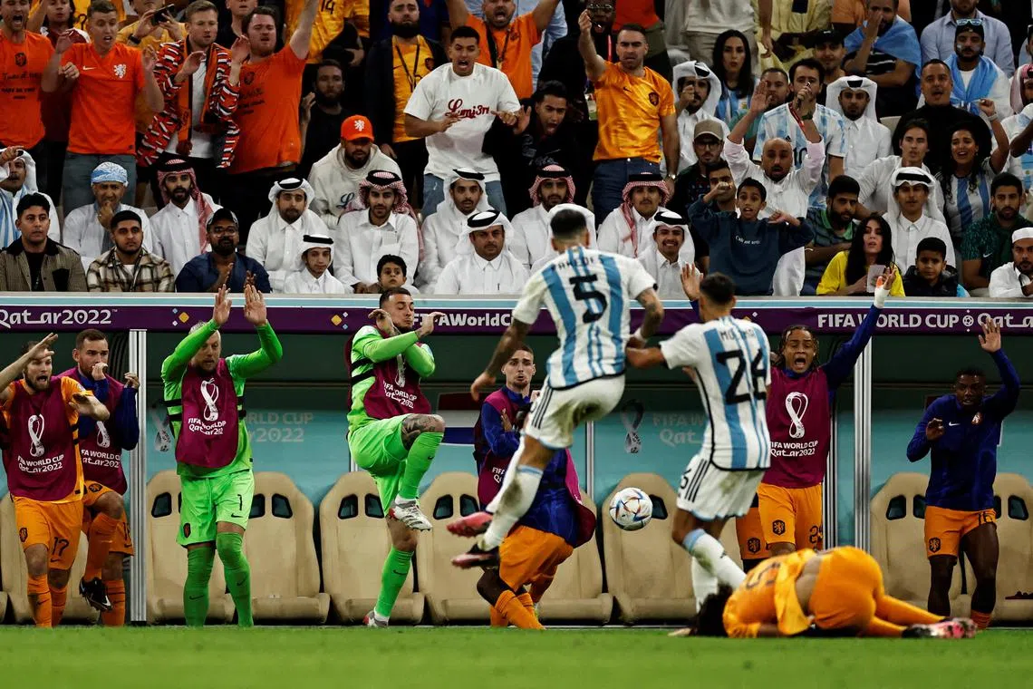 Argentina's Leandro Paredes kicks the ball at the Netherlands substitutes. This sort of loss of composure could hurt the Argentinians.   