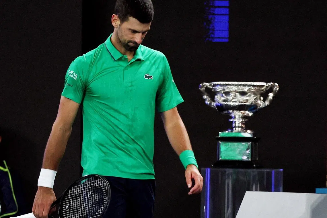 Tennis - Australian Open - Melbourne Park, Melbourne, Australia - February 1, 2026 Serbia's Novak Djokovic during the men's singles final against Spain's Carlos Alcaraz as the trophy is on display REUTERS/Edgar Su