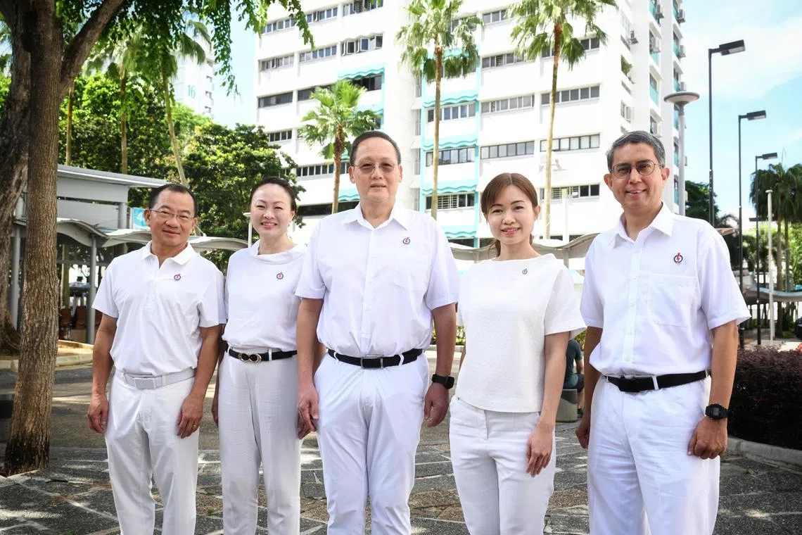 Dr Tan See Leng (centre) with teammates for PAP’s Marine Parade-Braddell Heights GRC slate (from left) Seah Kian Peng, Diana Pang, Tin Pei Ling and Muhammad Faishal Ibrahim. 