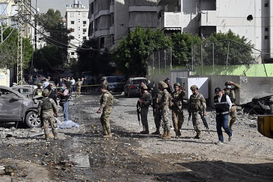 Lebanese soldiers inspecting the site of an Israeli air strike in southern Beirut on March 28. 