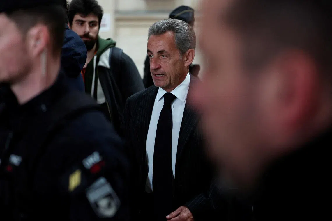 Former French President Nicolas Sarkozy arrives for the decision in his appeal trial in the "Bygmalion" case, which concerns the illegal financing of his lost presidential campaign in 2012, at the courthouse in Paris, France, February 14, 2024. REUTERS/Gonzalo Fuentes/File Photo