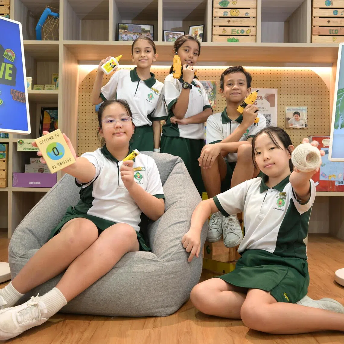 jndesign14/ST20250829_202535500757/Ng Sor Luan/Clockwise from left (front row): Serena Wei, 12, Syaurah binte Ziad As-Samet, 12, Nur Zara Arissa, 12, Muhd Shauqi, 12 and Guo Zi Xuan, 12 from Xingnan Primary worked with architects to design a learning space in their school, learning about concepts like design thinking and how to balance style and function.