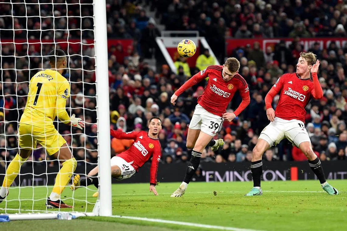 Scott McTominay (centre) of Manchester United beating Chelsea goalkeeper Robert Sanchez to score his second goal.