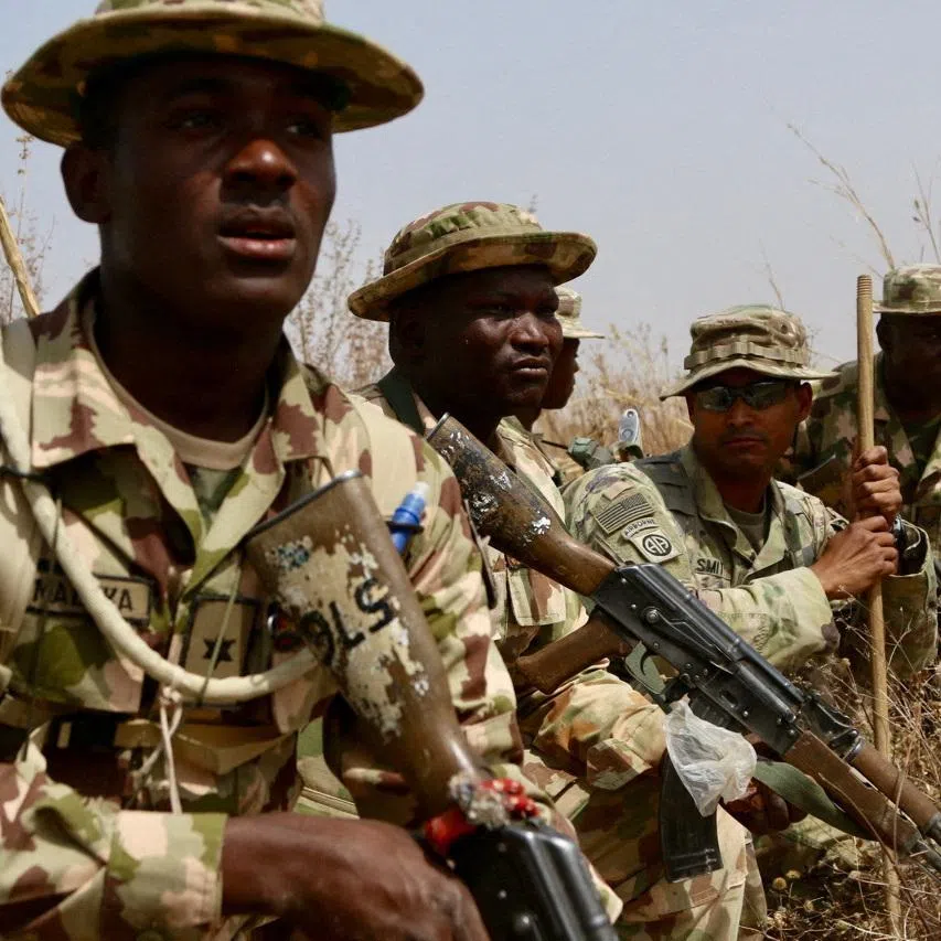 FILE PHOTO: A U.S. Army soldier (2R) trains Nigerian Army soldiers at a military compound in Jaji, Nigeria, February 14, 2018.    Capt. James Sheehan/U.S. Army/Handout via REUTERS/File Photo