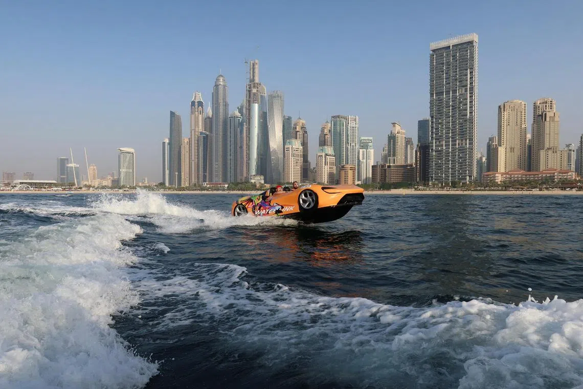 A person drives a jet car, a car shaped speed boat, in Dubai, United Arab Emirates, Feb 3, 2023. 