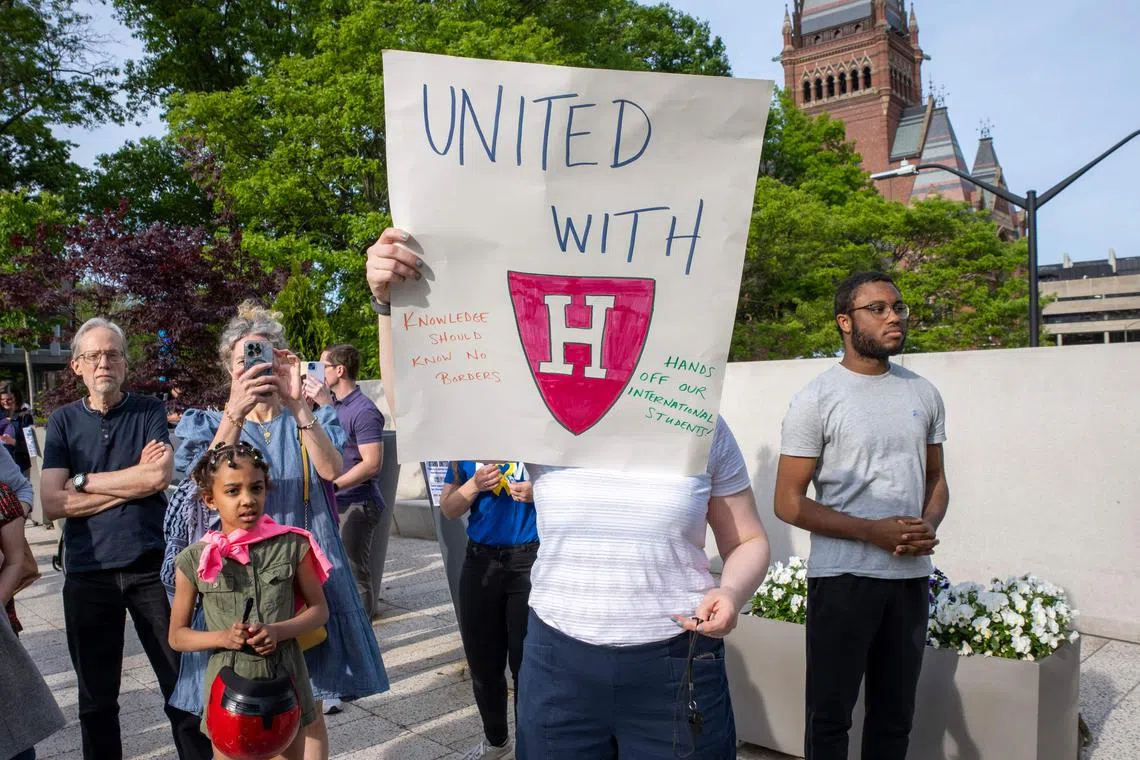 A person holds up a sign during the Harvard Students for Freedom rally in support of international students at the Harvard University campus in Boston, Massachusetts, on May 27, 2025. Harvard students protested Tuesday after the US government said it intends to cancel all remaining financial contracts with the university, President Donald Trump's latest attempt to force the prestigious institution to submit to unprecedented oversight. (Photo by Rick Friedman / AFP)