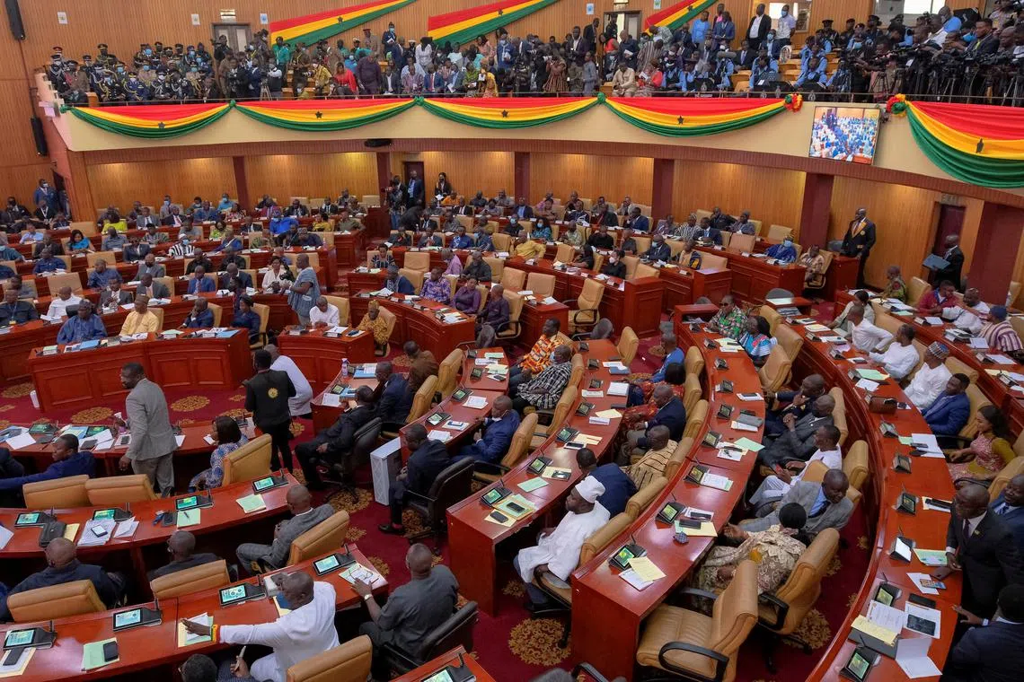 FILE PHOTO: Parliamentarians and members of the public listen as Ghanaian President Nana Akufo-Addo delivers his annual state of the nation address to the parliament in Accra, Ghana, March 30, 2022. REUTERS/Francis Kokoroko/File Photo