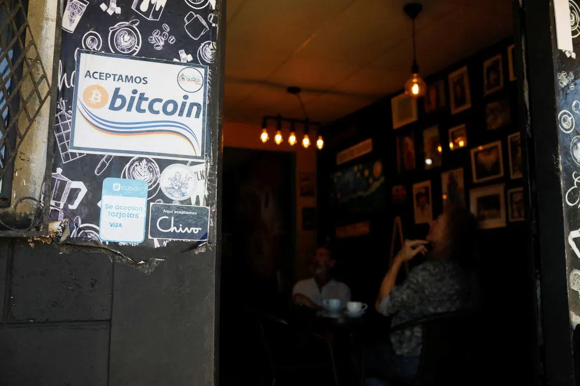 Members of a local Bitcoin community, gather in a local cafe in Berlin, El Salvador, January 24, 2024. REUTERS/Jose Cabezas/File Photo