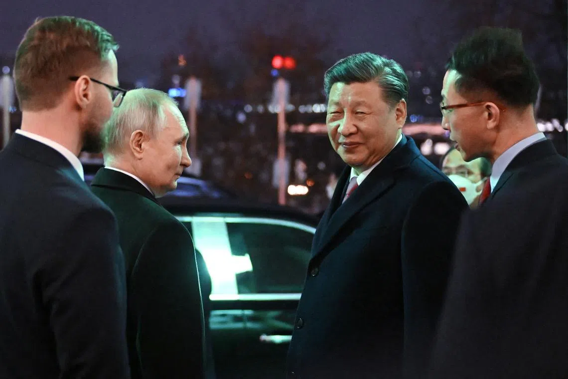 Russian President Vladimir Putin seeing off Chinese President Xi Jinping after a reception at the Kremlin in Moscow on March 21, 2023. 