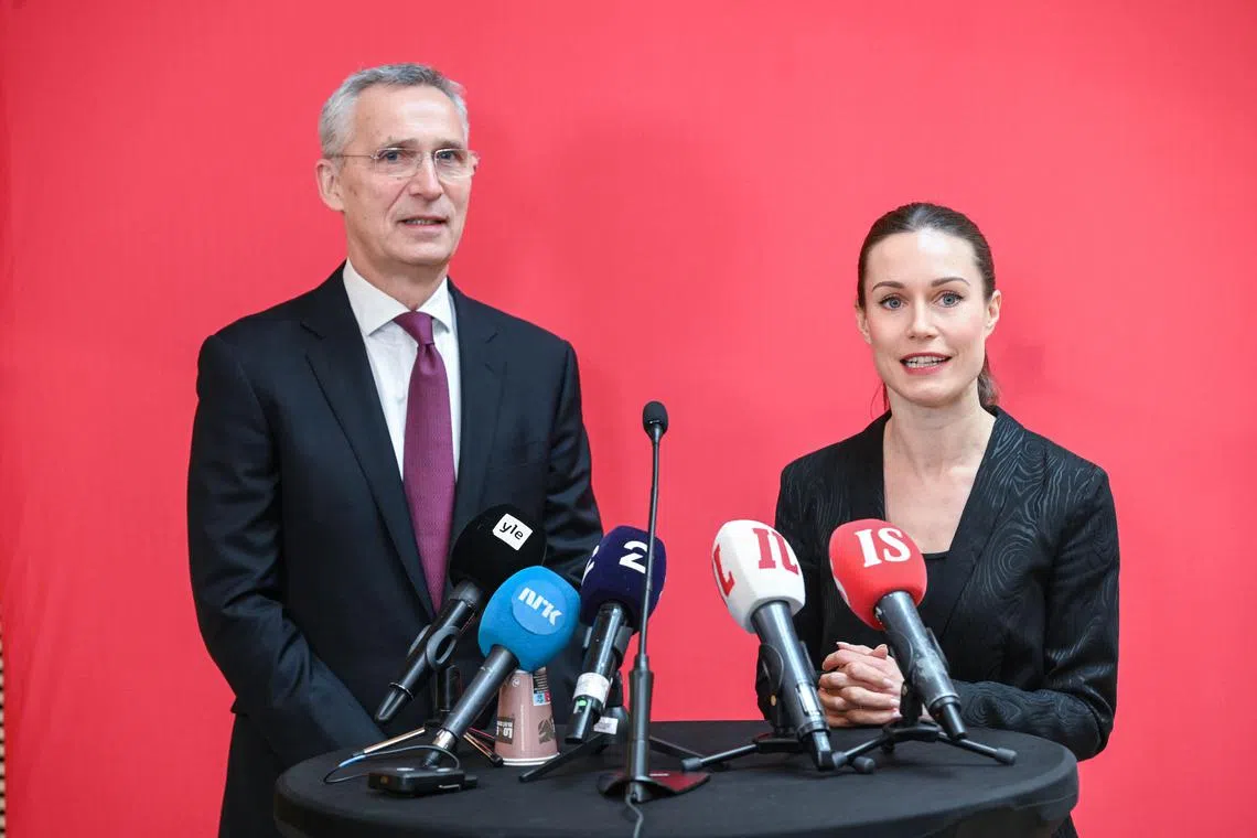 Nato Secretary General Jens Stoltenberg (L) and Finnish Prime Minister Sanna Marin brief the media in Helsinki.