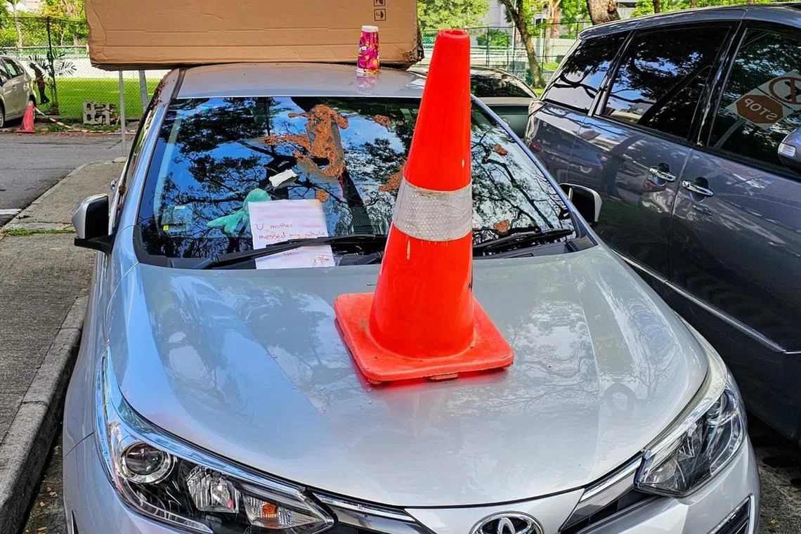 A note placed under the front windscreen wiper of the car referred to a person by name and said that the person “messed my whole family”.